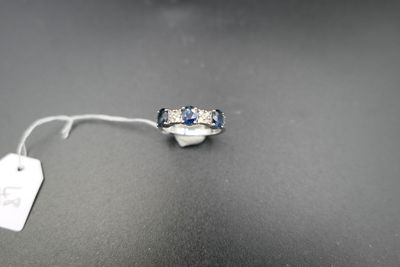a picture of a diamond and sapphire ring with a price tag attached to it
