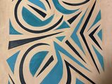a picture of a blue and black design on a piece of paper