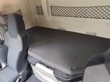 two seats in the back of a van with a mattress