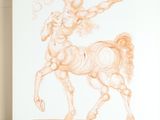 a drawing of a man riding a horse on the ground