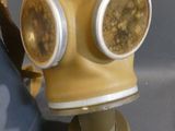 a yellow gas mask with goggles on top of it