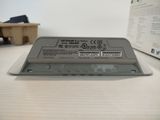 a close up of a laptop battery on a table