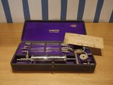 a purple case with tools in it sitting on a table