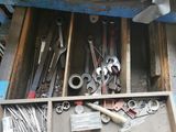 a box full of tools that are sitting on the floor
