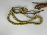 a pair of scissors and a rope on a table