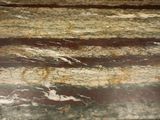 a close up of a marble counter top with a clock on it