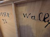 a wooden box with writing on it in a room
