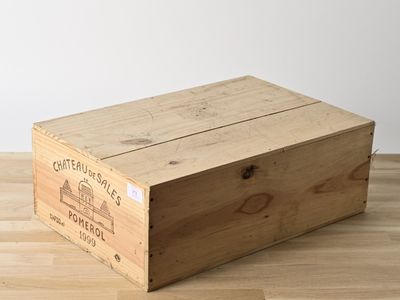 a wooden box that is sitting on a wooden floor