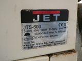 a jet that is sitting on the side of a building