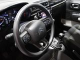 a steering wheel and dashboard of a car in a car showroom