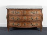 an old wooden chest of drawers with marble top