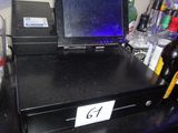 a laptop sitting on top of a black counter