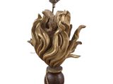 a statue of a flower on a pedestal with a rope