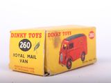 a red toy truck that is sitting in a box