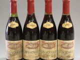 three bottles of red wine are lined up in a row