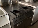 an image of a kitchen with stainless steel appliances
