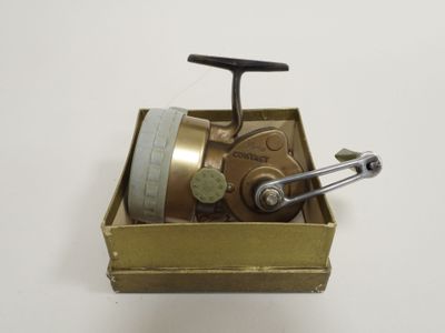 a small metal box with a metal handle and a handle on it