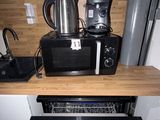 an image of a kitchen with a microwave and a toaster oven