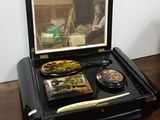 a suitcase that has a tray with food inside of it
