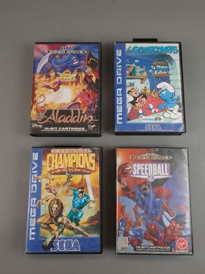 three video games are sitting on a table next to each other