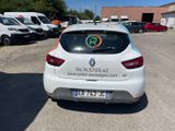 a white car parked in a parking lot with other cars in the background