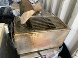 a dirty machine that is sitting on a pile of boxes