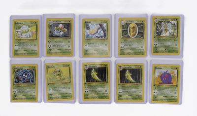 a close up of a bunch of pokemon cards on a table