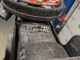 a close up of a motor bike with a black seat