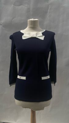 navy blue and white dress with white collared neck and cuffs