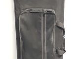 a black bag with a zipper on it sitting on the floor