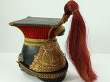 a doll with a long red hair and a hat on it