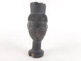 an image of a wooden head with a crown on top of it