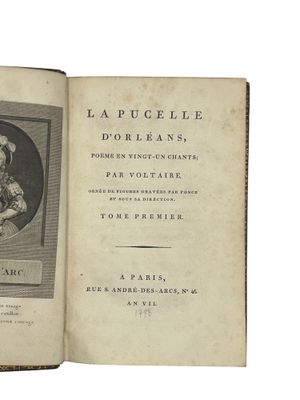 an old book with a picture of a woman in a dress