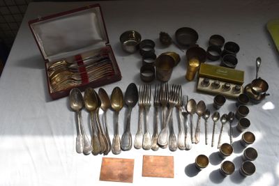 a lot of silver spoons and forks on a table