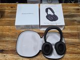 a pair of headphones sitting on top of a wooden table