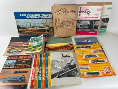 several books are stacked on top of each other on a table