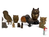 many different types of figurines displayed on a white surface