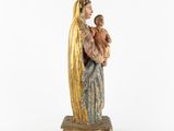 a statue of a woman holding a child in her arms