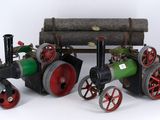 a small model of a steam engine with a log on it
