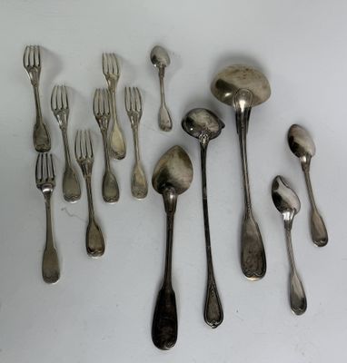 a lot of silver spoons and forks on the table