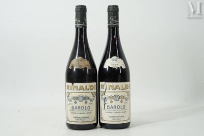 two bottles of wine sitting next to each other on a table