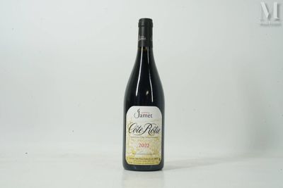 a bottle of wine that is sitting on a table