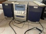 a radio that is sitting on the floor next to other electronics