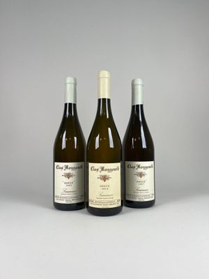 three bottles of wine sitting next to each other on a table