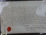 un morceau de papier portant un cachet de cire