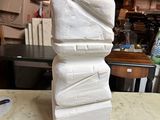 a white sculpture sitting on top of a marble table