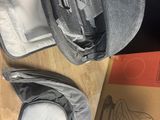 a bag that is sitting on the floor next to a box