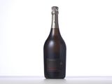 the bottle of champagne is sitting on the table with a white background