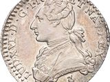 pièce de monnaie en argent portant l'image d'une tête d'homme