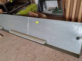 a picture of a metal door in the middle of a room